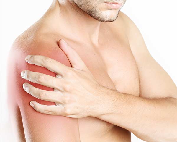 muscle-pain-shoreside-pain-sarasota-florida Man holding shoulder to show muscle pain. Shoreside Pain in Rogers, Arkansas